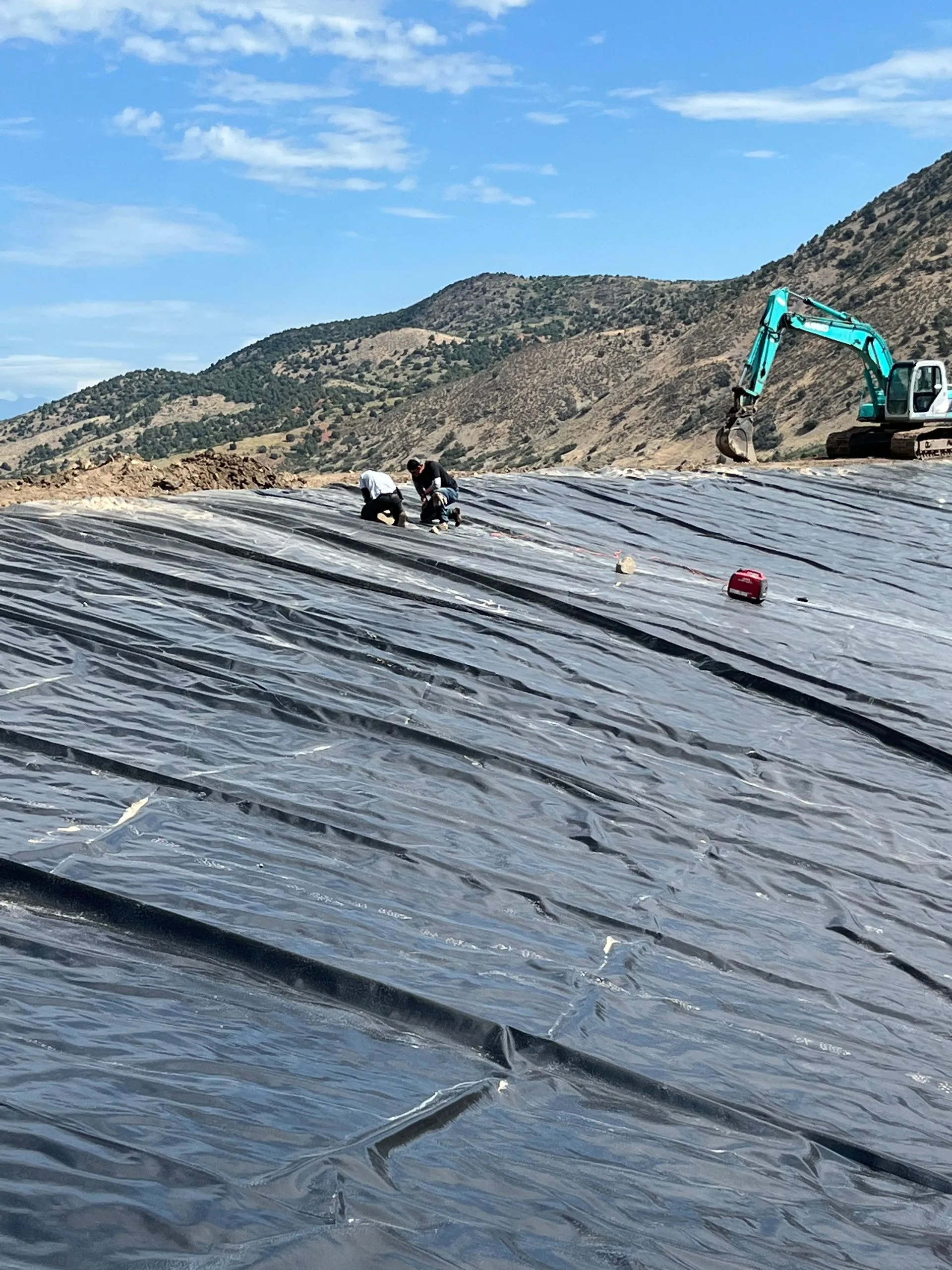 Precision grading and liner installation project